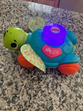 Fisher price turtle moves and lights up